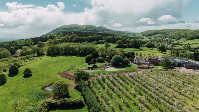 Notehouse Farms with orchards, ponds, fields, and wooded hills